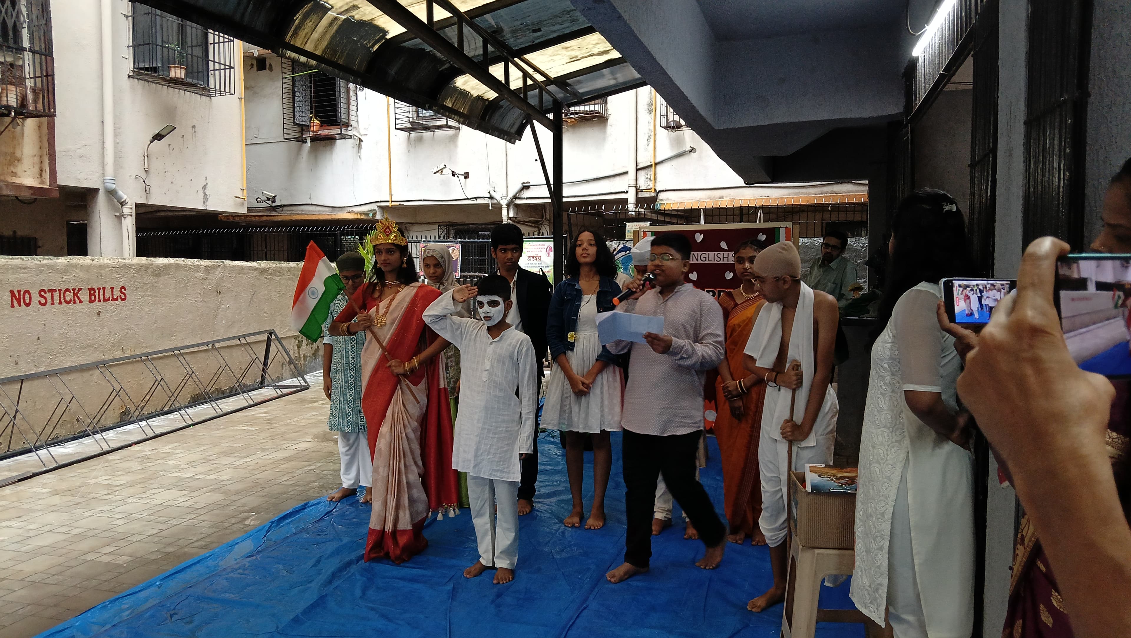 Students gathered on the school grounds during the Independence Day flag hoisting ceremony