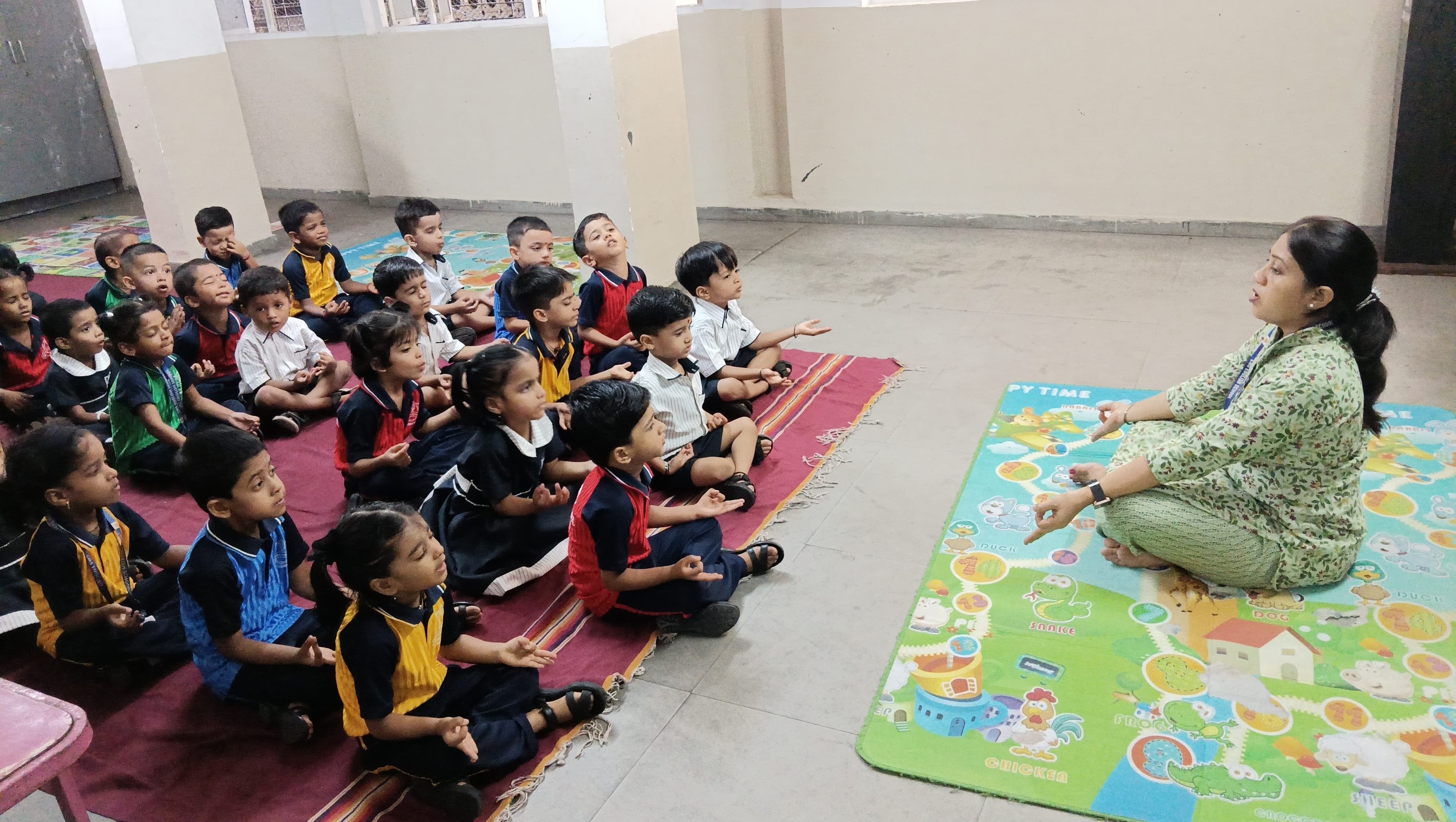 Students and teachers gathered together in the school courtyard during a celebration